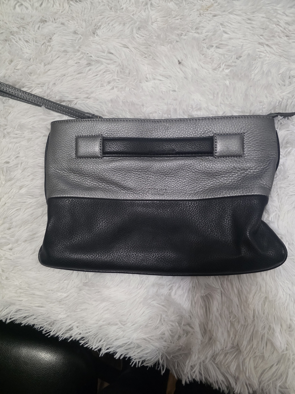 Perlina Two-Tone Silver and Black Leather Wristlet Clutch.